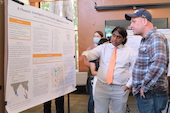 Nishant Suria and Grant discussing poster
