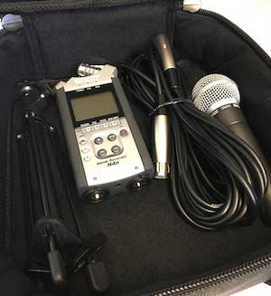 Recording kit containing a Zoom recorder, Shure microphone, and stand